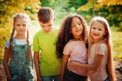 Group of Kids Playing Cheerful Park Outdoors. Children Friendship Together Smiling Happiness Concept