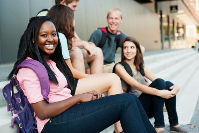 Young woman smiling with friends