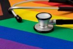 Rainbow pride flag and stethoscope. Transgender and LGBTQ+ health